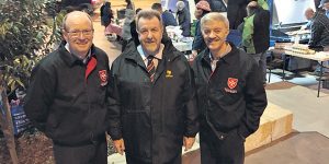 Practical Charity: Judge Rackemann, Councillor Paul Tully and Derek Pingel at a BBQ at The Diggers Rest Park, Goodna. Picture: Catholic Leader