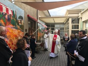 Bishop Terry Curtin, a chaplain of the Order, blessing the Piazza San Francesco