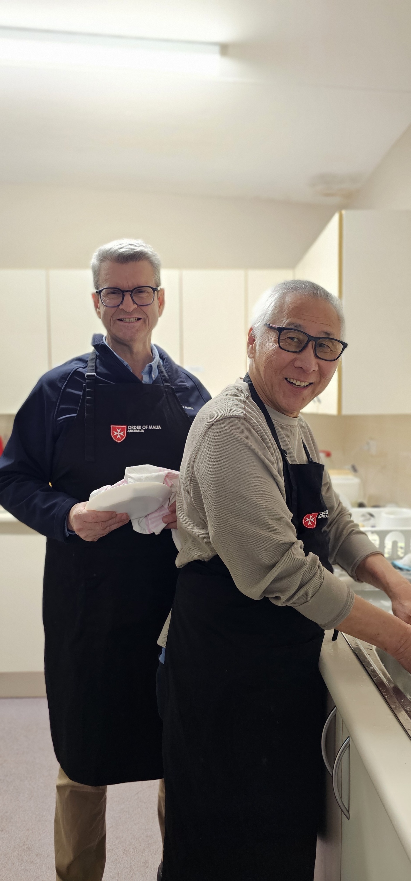 John Murphy and Daniel Kwok washing up