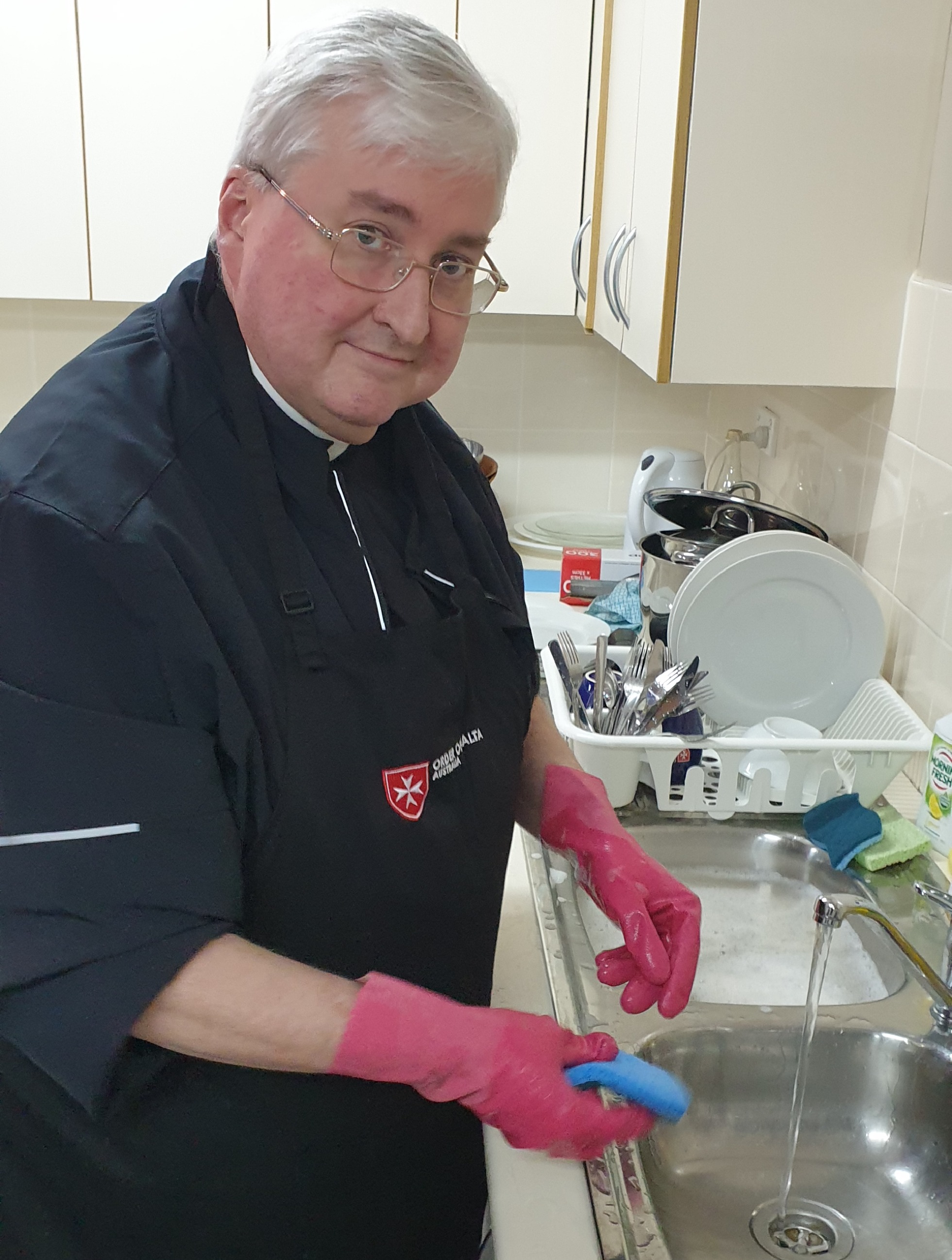Fr Robbie washing up