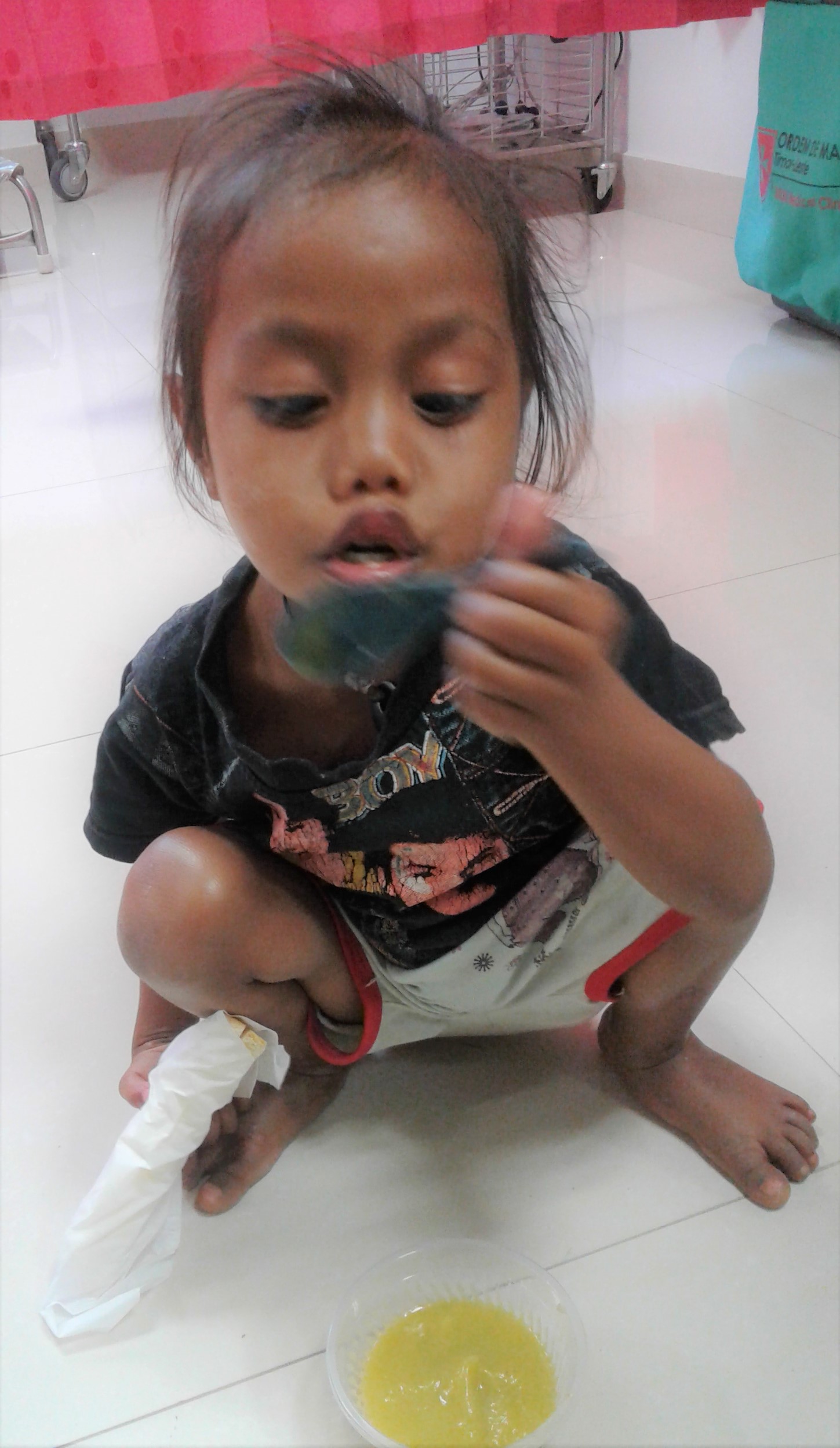 a child blowing her soup to make it cold - Copy